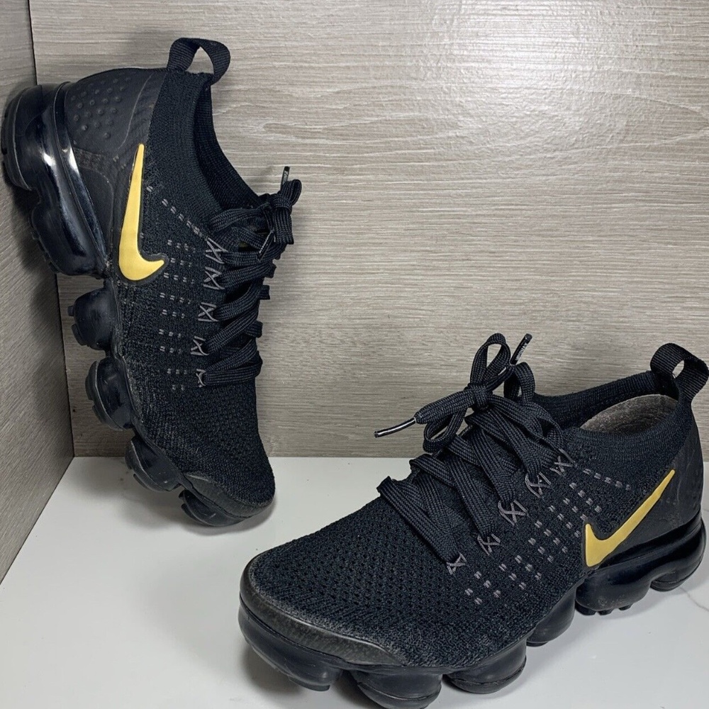 Nike Black Athletic Shoes with Yellow Swoosh